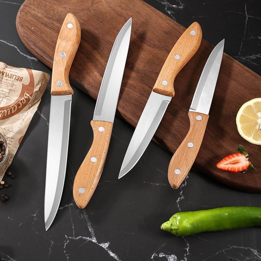 Paring knife, one of the essential kitchen knives for beginners, used for precision peeling tasks as taught in kitchen knives 101.